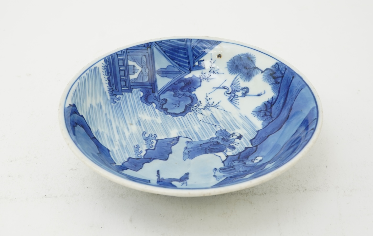 A Chinese blue and white saucer dish, Kangxi six character mark and of the period (1662-1722)